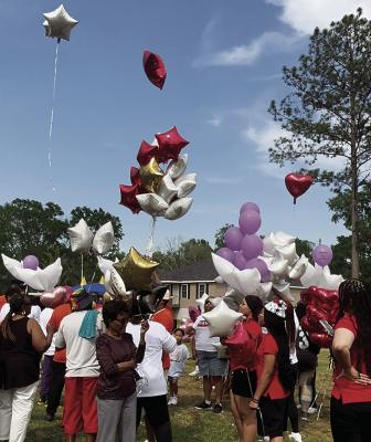 A balloon launch in memory of deceased residents was among the festivities at the Second Annual Pleasant View Subdivision Reunion on April 6 in New Roads. Photo by John Dupont