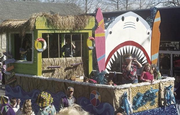 Photo by John Dupont ‘Fins’ from the Mothers’ Culture Club placed first in the float competition Tuesday in the 80th Annual New Roads Lions Club Mardi Gras Parade.