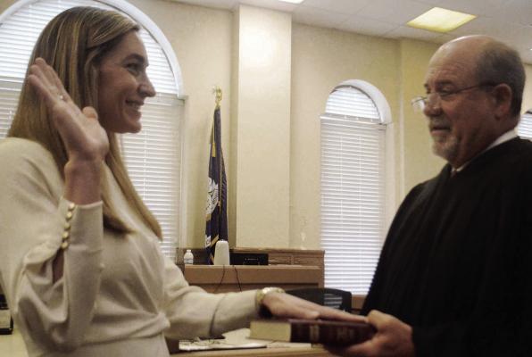 Eighteenth Judicial District Court Judge Kevin Kimball administered the oath of office to incoming Pointe Coupee Parish Clerk of Court Becky Ewing Miller during a ceremony June 28 at the Pointe Coupee Parish Courthouse. Photo by John Dupont