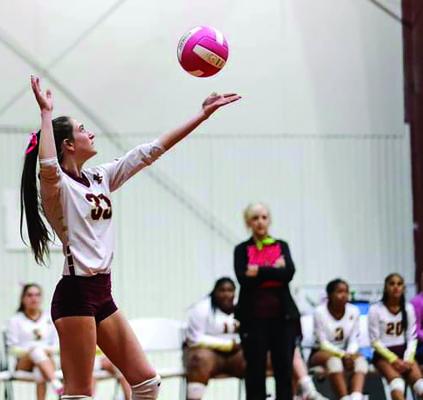 Kinsley Arnaud prepares to serve for False River Academy in recent volleyball action. False River travels to the Lafayette area to face Ascension Episcopal in the first round of the Division V state playoffs.